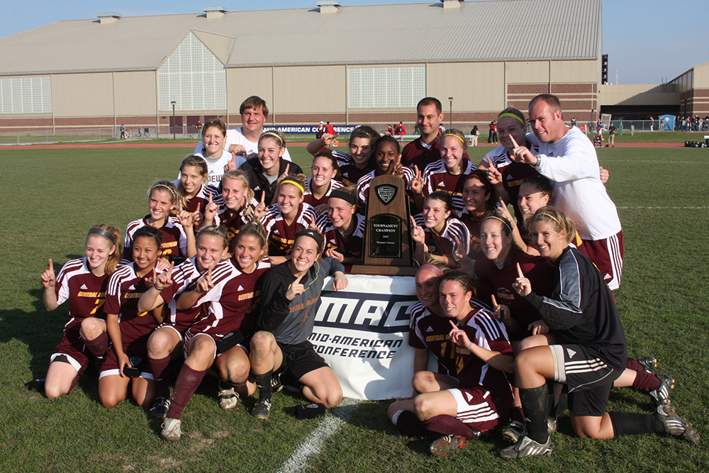 CMU team poses for photo with MAC championship trophy